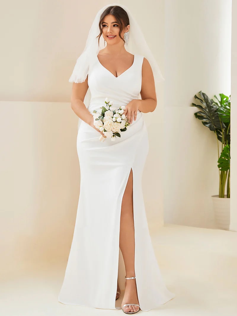 White plus sized wedding dress with mermaid tail, sleeveless, split and v-neck.